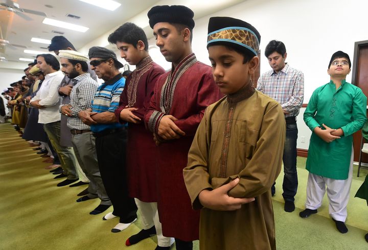 Muslims pray while celebrating Eid al-Fitr, marking the end of fasting during the month-long Ramadan, at the Baitul Hameed Mosque in Chino, California on July 6, 2016.