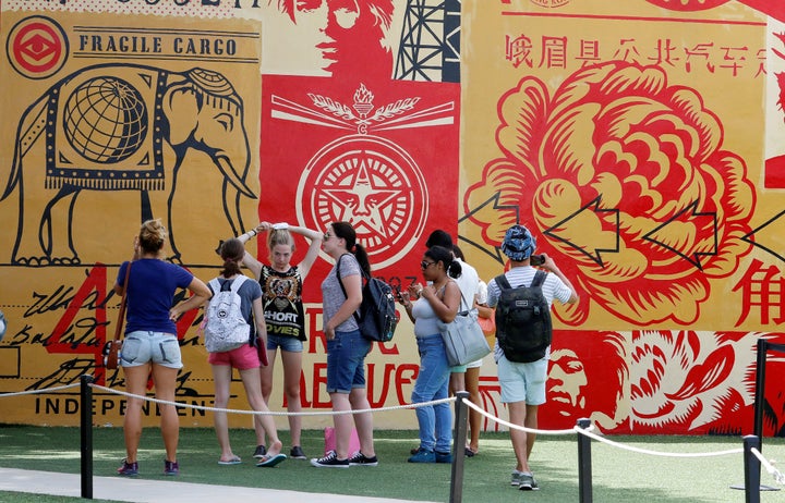 The U.S. Centers for Disease Control and Prevention advised pregnant women this week to avoid Wynwood, a neighborhood in downtown Miami where Zika virus appears to be rapidly spreading. Above, visitors walk through Wynwood.