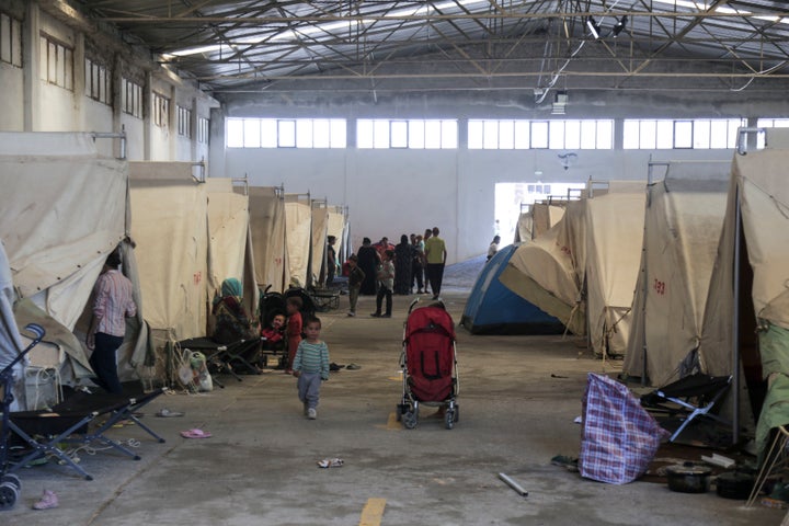 The Vasilika refugee camp is a military-run refugee camp located in an old warehouse in Vasilika village, Greece on 11 July 2016. There is no ventilation inside, and the roof is sheet metal increasing the high summer temperatures inside. The running water is low and warm. Food is very bad sometimes. The camp opened on 14 June 2016 to host refugees evicted from the Idomeni refugee camp. Some refugees have denounced to the media the poor conditions.