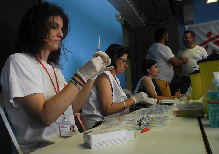 Doctors Without Borders prepares vaccines. The aid group vaccinated more than 5,000 children in refugee camps in Greece in re