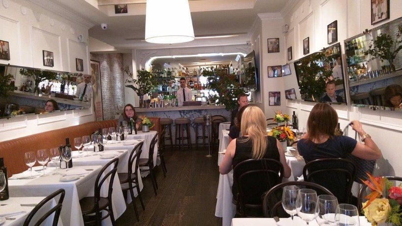 Mirrors and celebrity photos line the walls of MAMO Restaurant