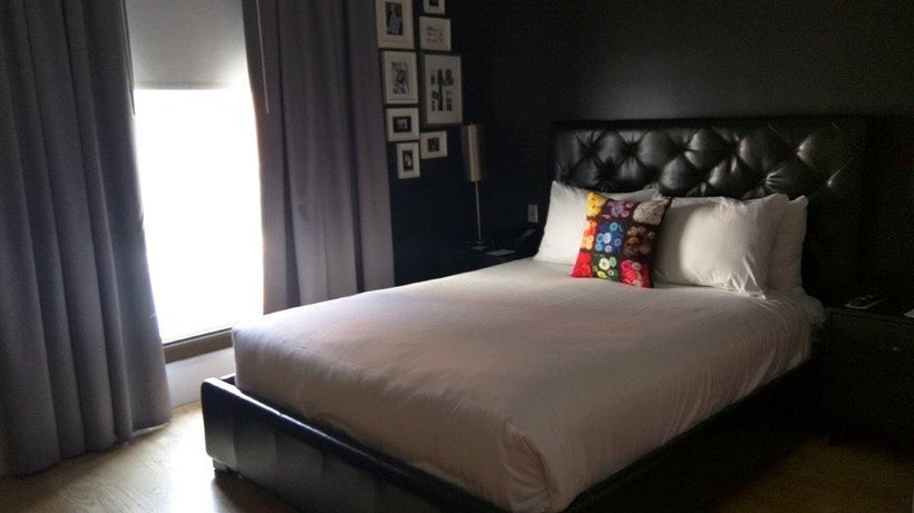 Photos of old New York decorate bedroom walls