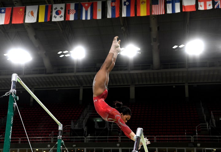 Gabby Douglas practices on the uneven bars during a training session on Thursday in Rio de Janeiro.