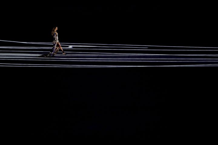 Supermodel Gisele Bundchen walks as The Girl From Ipanema during the Bossa segment during the Opening Ceremony of the Rio 2016 Olympic Games at Maracana Stadium on August 5, 2016 in Rio de Janeiro, Brazil.