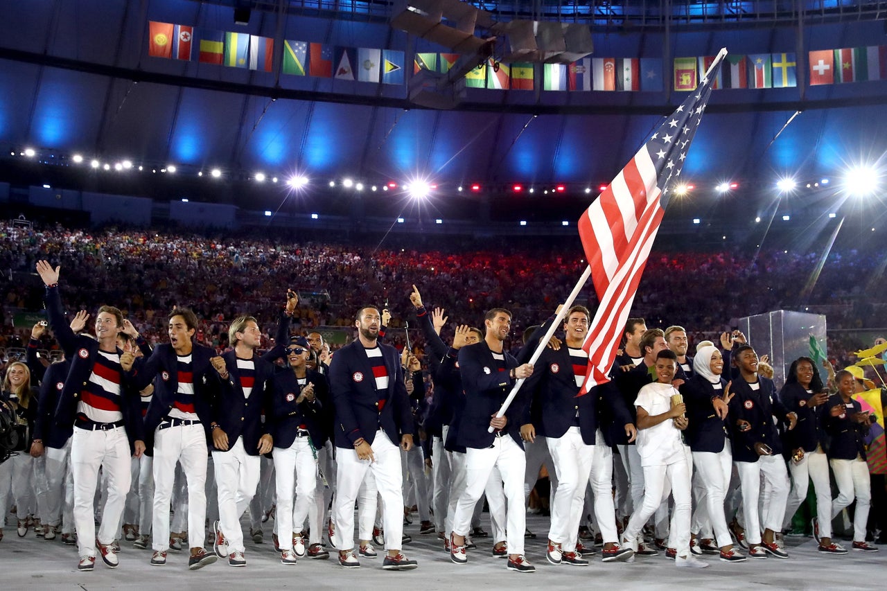 Michael Phelps of the United States carries the flag during the Opening Ceremony of the Rio 2016 Olympic Games.