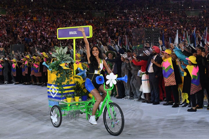 A woman on a bicycle leads the Brazil delegation during the opening ceremony of the Rio 2016 Olympic Games at the Maracana stadium in Rio de Janeiro.