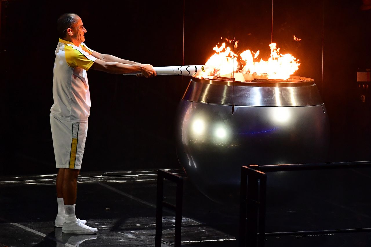Former Brazilian athlete Vanderlei Cordeiro lights the Olympic cauldron with the Olympic torch during the opening ceremony of the Rio 2016 Olympic Games at Maracana Stadium in Rio de Janeiro on August 5, 2016.
