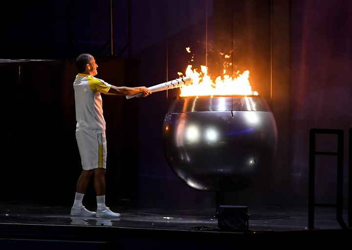 <strong>Final torch bearer Vanderlei Cordeiro de Lima lights the Olympic Cauldron.</strong>