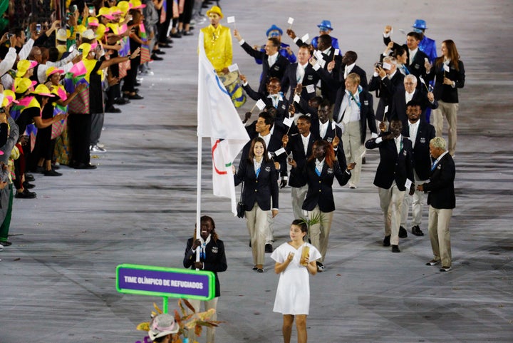 <strong>Flagbearer Rose Nathike Lokonyen (ROT) of the Refugee Olympic Athletes leads her contingent during the opening ceremony.</strong>