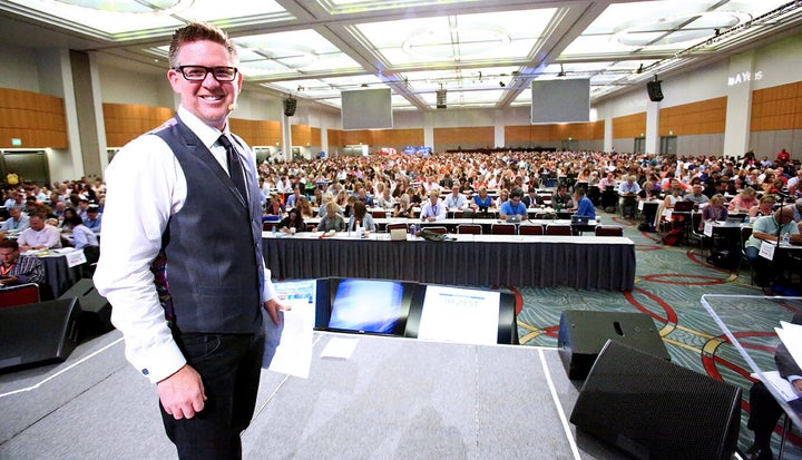 Ferry on stage at his biggest annual event with several thousand people.