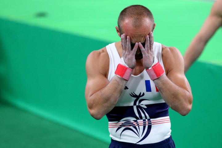 France's Danny Pinheiro Rodrigues reacts after teammate Samir Ait Said broke his leg while competing on the vault on Day 1 of the Rio 2016 Olympic Games.