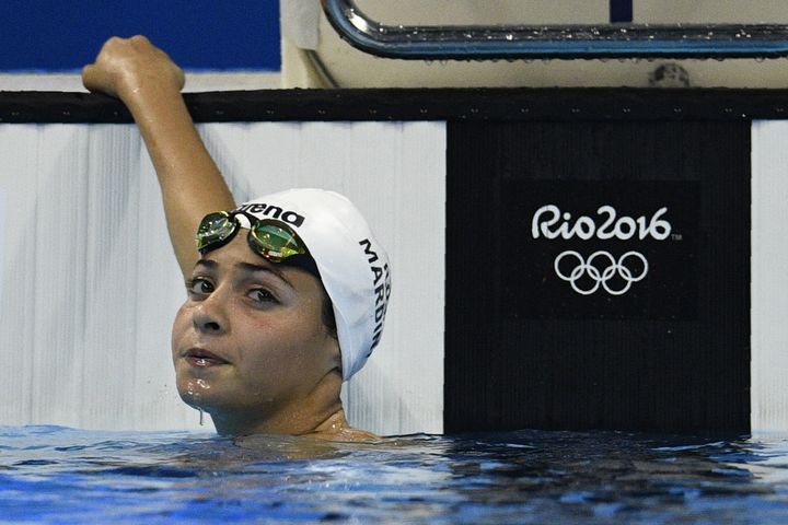 Refugee Olympic Team's Yusra Mardini won her heat in the women's 100m butterfly