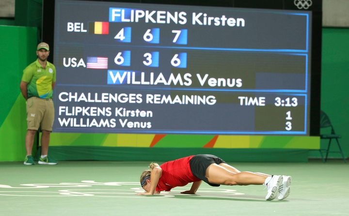 Kirsten Flipkens of Belgium celebrates after winning her match against Venus Williams on Saturday.