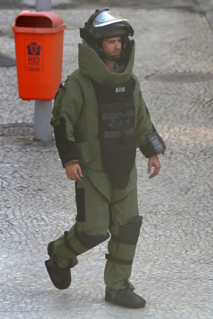 The Brazillian bomb squad carry out a controlled explosion of a bag near the finish line of the Men's Road Race