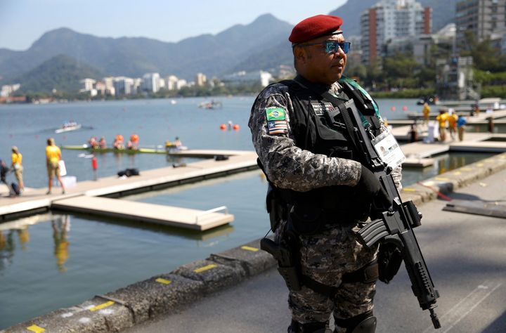 A security guard stands by the Lagoa rowing venue.