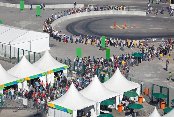 Long lines form at the security check point leading into the press and broadcast centre at the Olympic Park.