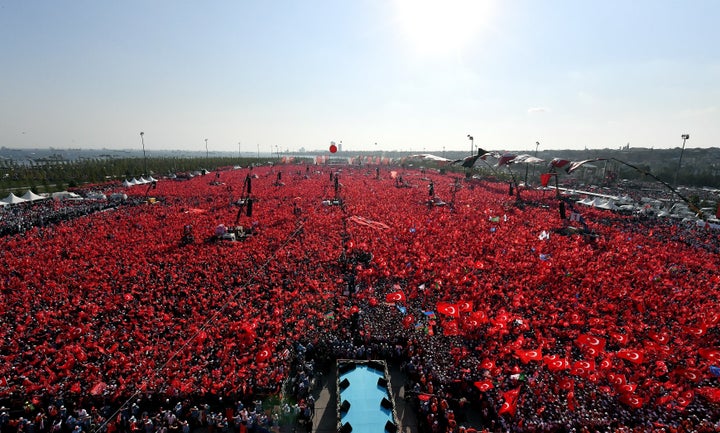 People hold Turkish flags as they take part in Democracy and Martyrs' Rally, held to protest against the July 15 failed coup, in Istanbul.