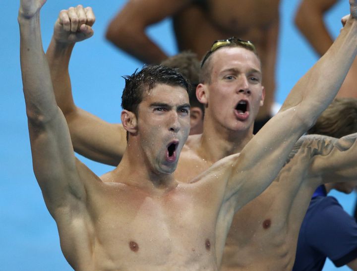 Michael Phelps of USA reacts after his team won the gold.
