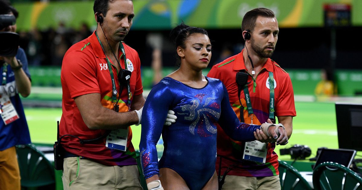 Should We Really Cheer When An Olympic Gymnast Plays Through