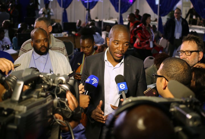 Democratic Alliance leader Mmusi Maimane gestures as he speaks to members of the media at the result center in Pretoria, South Africa.