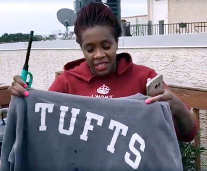Wagatwe Wanjuki prepares to burn her first Tufts sweatshirt on Monday, August 8, 2016 as part of the #JustSaySorry campaign.
