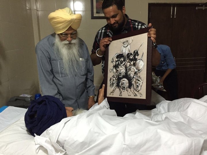 Bapu Ji being given artwork by artist <a href="https://twitter.com/rinnyrio" target="_blank">RiNnyRiO</a> (courtesy <a h