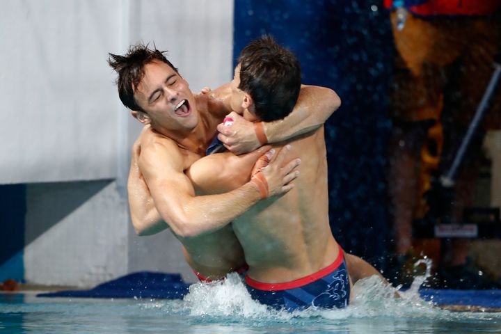 Tom Daley and Dan Goodfellow fall sideways into the pool.
