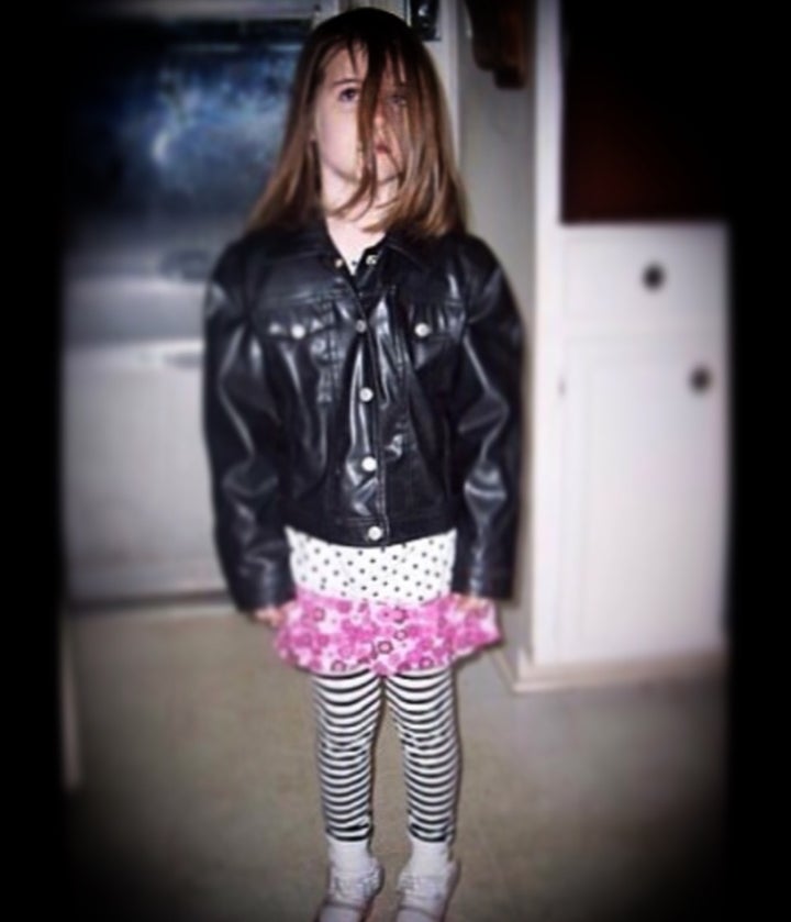 My daughter, showcasing one of her childhood signature church looks: deviant punk. 