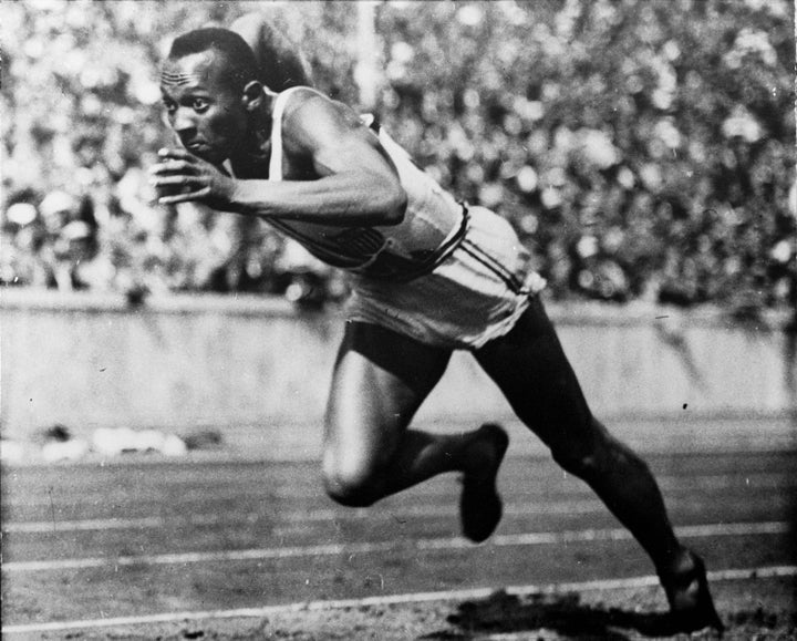 In this 1936 file photo, Jesse Owens of the United States runs in a 200-meter preliminary heat at the 1936 Summer Olympics in Berlin. Owens won four gold medals at the 1936 Berlin Olympics and showed up Adolph Hitler's idea of Aryan supremacy.