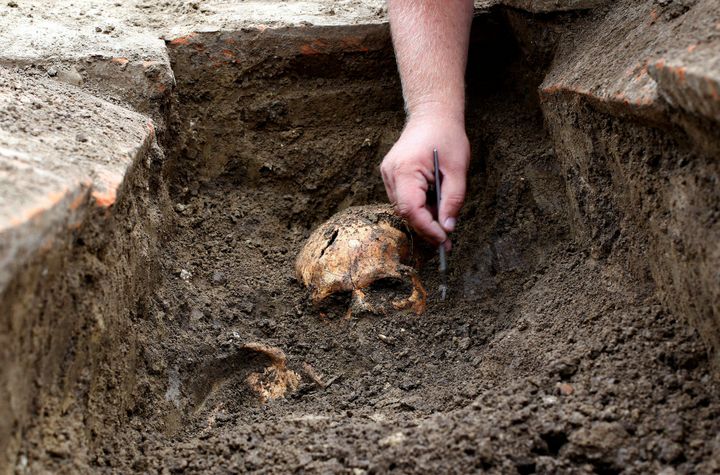Archaeologists in Serbia have unearthed skeletons that were buried with tiny scrolls covered in mysterious inscriptions.