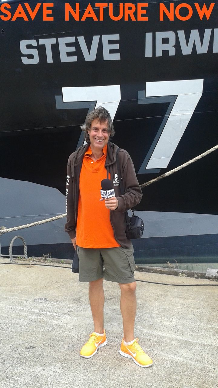 Earth Doctor Reese Halter Williamstown, Victoria in front of Sea Shepherd's flagship <em>The Steve Irwin</em>.