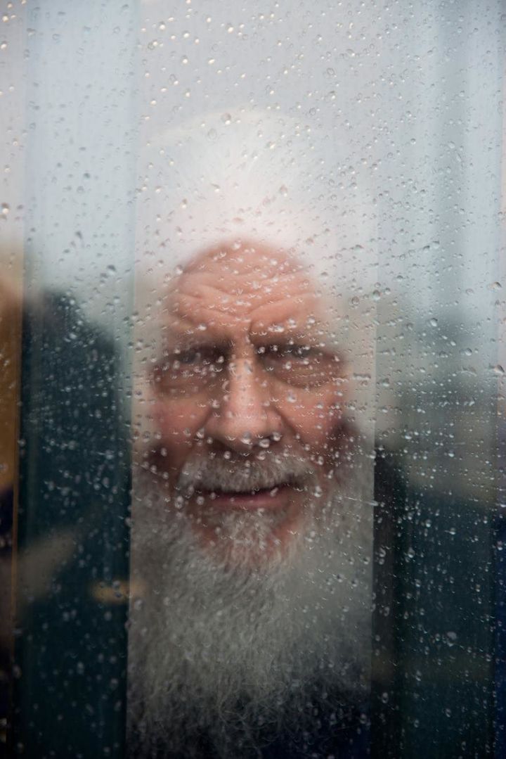Robert, 70, looks out his cell window. He has spent nearly 30 years in prison after being convicted of murder. In his free time, Robert mentors younger prisoners who have come in with drug addictions, something he's very passionate about.