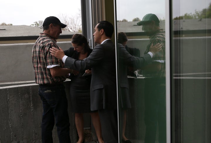 SUNNYVALE, CALIFORNIA - APRIL 08: Housing and Urban Development secretary Julian Castro (R) greet U.S. Marine Corp. veteran R