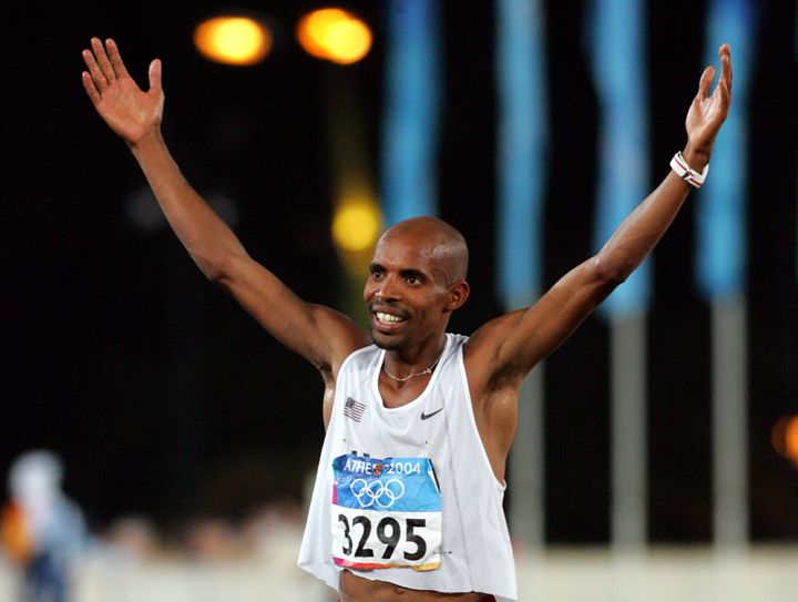 Mebrahtom Keflezighi celebrates after winning the silver medal at the men's marathon at the Athens 2004 Olympic Summer Games.