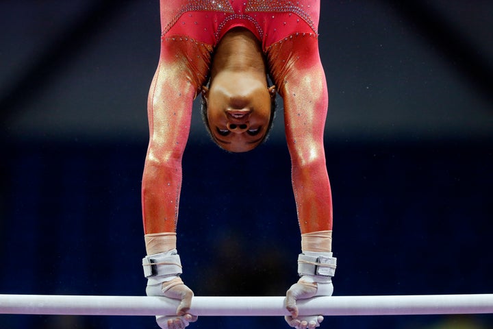 Gabby Douglas warms up on the uneven bars during the U.S. women's gymnastics championships, in June 2016, in St. Louis.