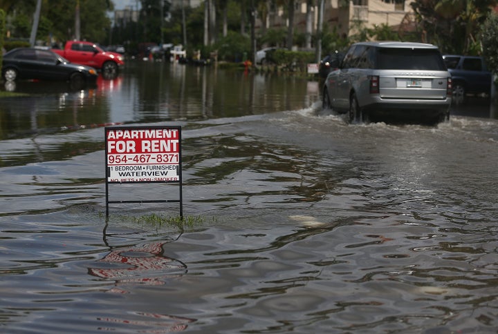 An apartment for rent sign is seen in a flooded Fort Lauderdale, Florida, street in September 2015. The conditions were caused by the combination of the lunar orbit and what many believe are the rising sea levels due to climate change. By the end of the century, rising sea levels could leave a significant number of U.S. homes underwater.