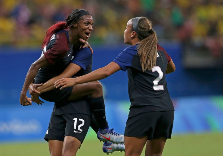 Crystal Dunn (left) and Mallory Pugh (2) celebrate Dunn's first-half goal against Colombia. Dunn and Pugh each scored their f