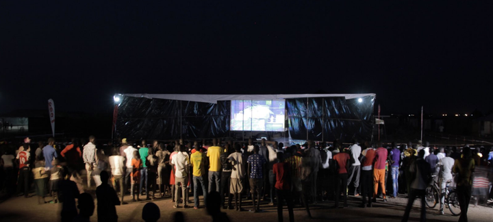 <strong>Refugees at the camp gather in front of a screen to watch the games</strong>