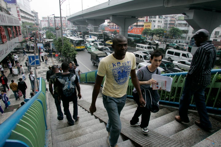 An African man walks up a foot bridge in the southern Chinese city of Guangzhou in Guangdong province.