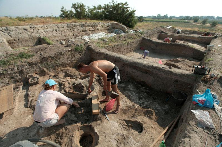 Bulgarian archaeologists dig during excavation works in an ancient settlement.