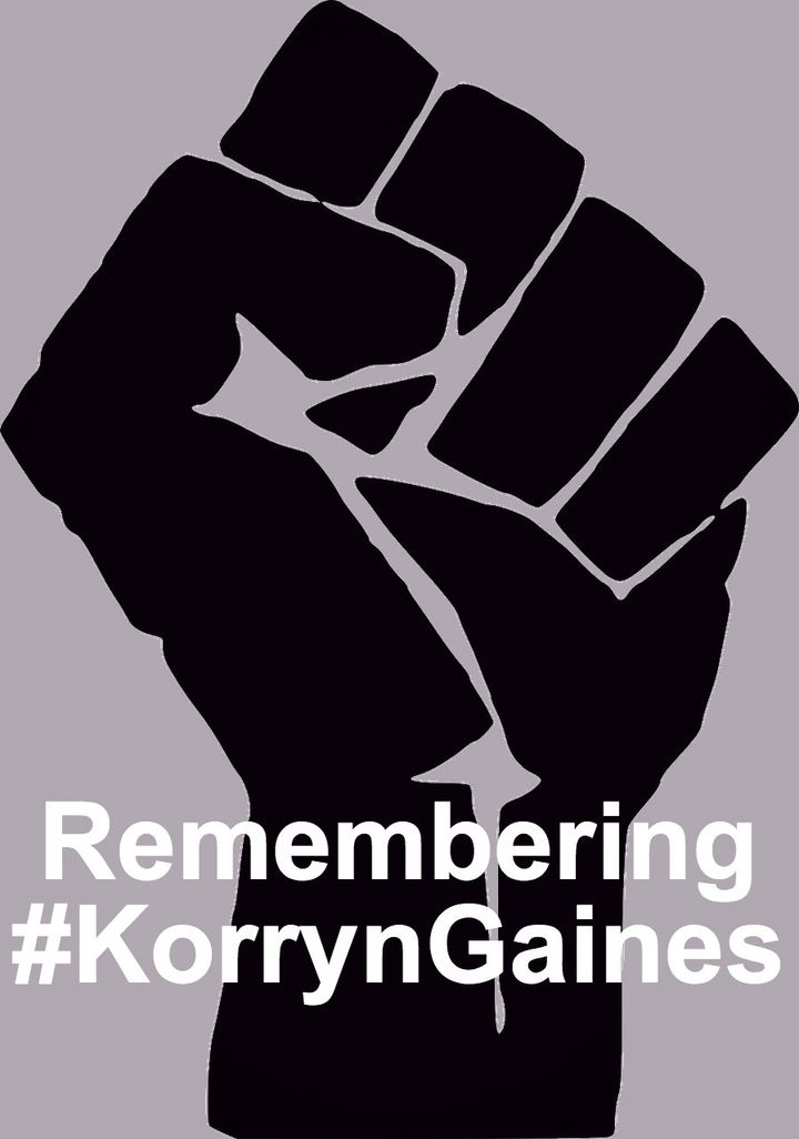 Black fist graphic against a muted purple-gray background. Wording on the wrist of the hand reads in bold white font: Remembering #KorrynGaines