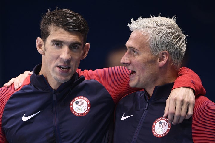 Phelps (left) and Lochte celebrate gold at the 2016 Olympic games. 