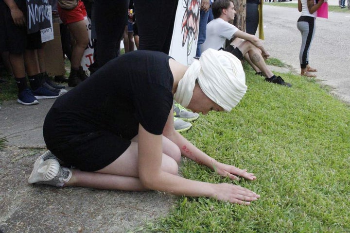 Blair Imani praying amidst the chaos