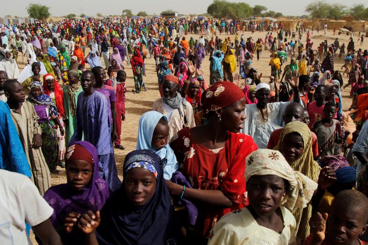 Nigerian refugees and displaced Nigeriens gather at a site for displaced persons in southeastern Niger, on June 18, 2016.