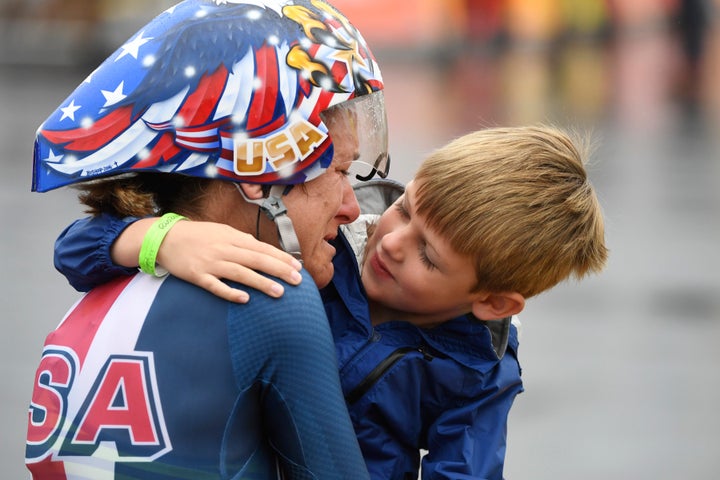 Kristin Armstrong hugs her 5-year-old son after winning the gold medal in the women's cycling road individual time trial at Rio 2016 on Wednesday.