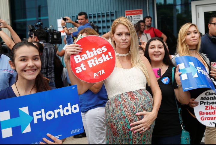 Supporters and protesters are seen outside of Borinquen Health Care Center before U.S. Democratic presidential nominee Hillary Clinton spoke about the Zika virus during a visit to the center in Miami, Florida, in August 2016.