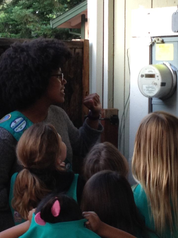 Adrienne shows Pleasant Hill Girl Scouts how to monitor electricity use.