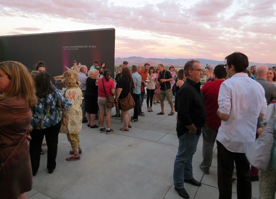 Tilting the Basin artists and guests gather on the Stacie Mathewson Sky Plaza.