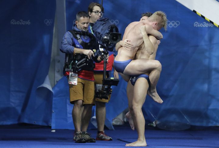 Britain's Jack Laugher and Chris Mears celebrate after winning gold in the men's synchronised 3-meter springboard