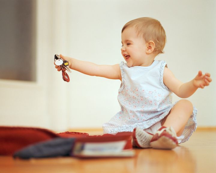 Little Girl Playing With Bunch Of Keys, Munich, Bavaria, Germany Lumi Images/Elsa Dunkel